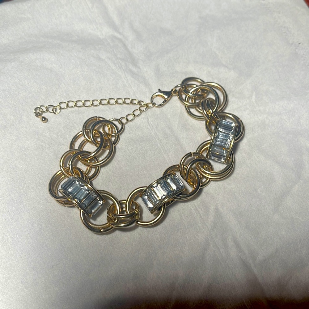 Gold tone link bracelet with clear crystals